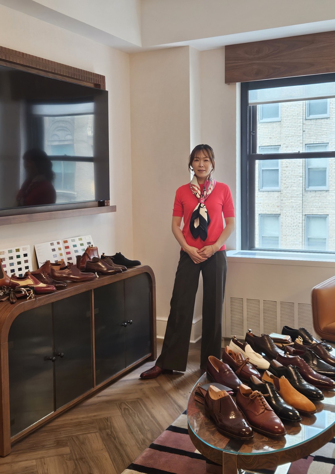 Emiko Matsuda at a trunk show with a collection of bespoke shoes